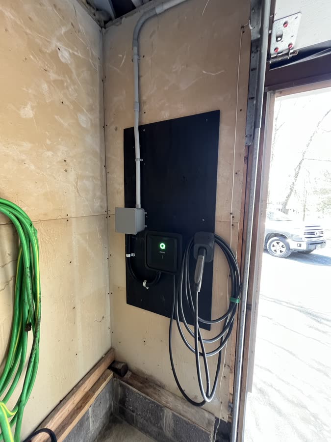 EVNOC EV charger installed in residential garage with dedicated sub-panel